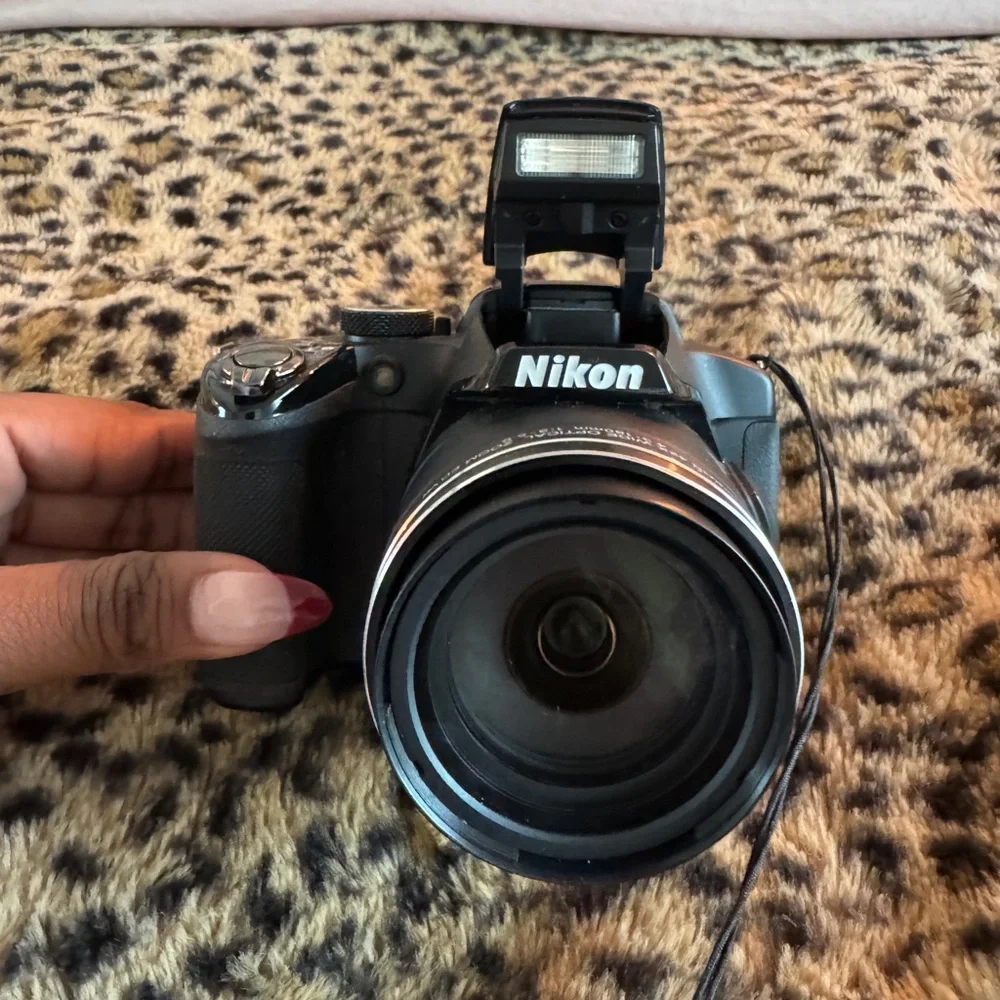 Nikon Black Camera with White Accessories